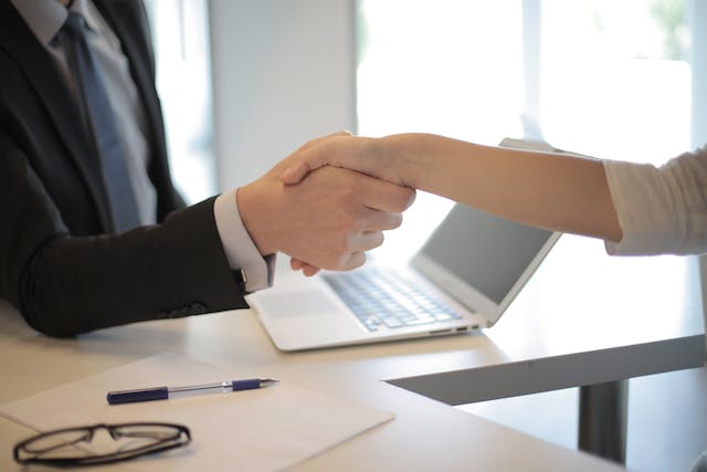 two-people-shaking-hands